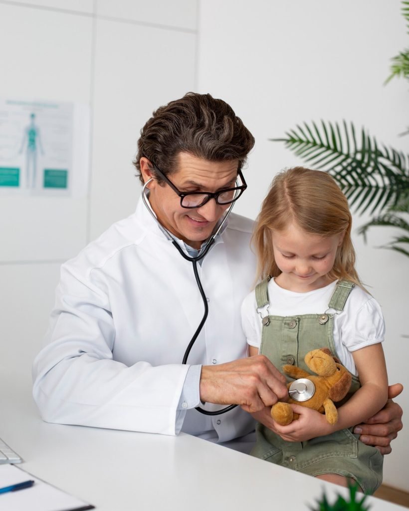 little-girl-with-teddy-bear-toy-doctor-s-appointment_23-2149187426
